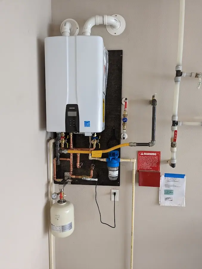 Professional plumber installing copper piping in a Pinellas Park home